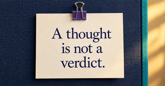 AI-generated cream reminder reading A thought is not a verdict, clipped to a navy fabric pinboard.
